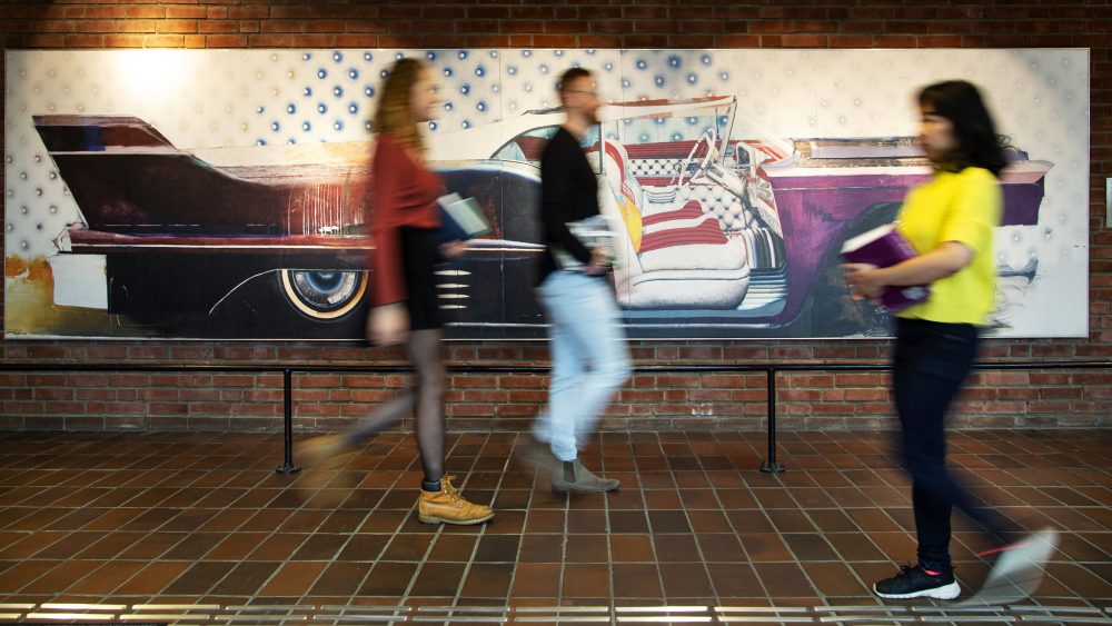 Blurred image people walking in urban street