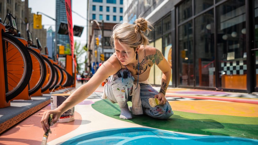 Woman painting on a street